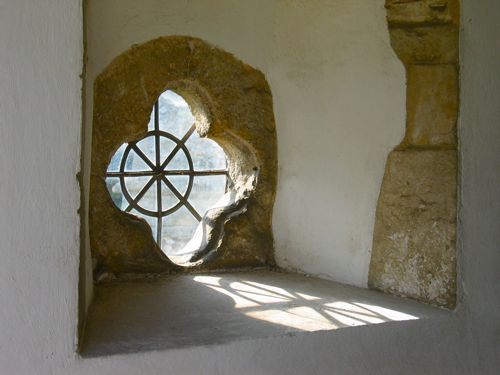 Porch window at Brancaster church